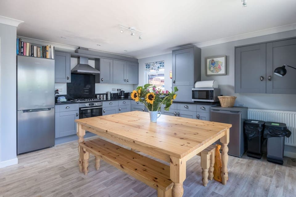 The kitchen with a dining table, fridge/freezer and oven - Lodge 27