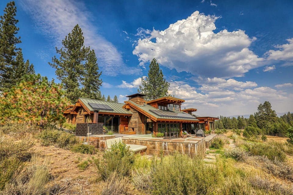 South-facing rear of house. Looks across a 100yd meadow to the 18th fairway 