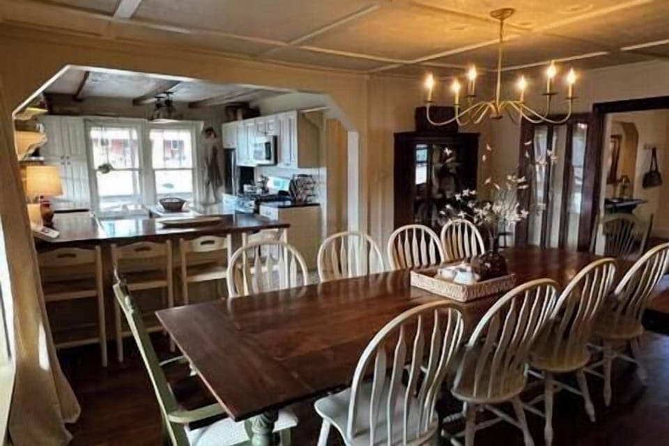 Dining room with view into kitchen; space to both prepare and enjoy a large meal