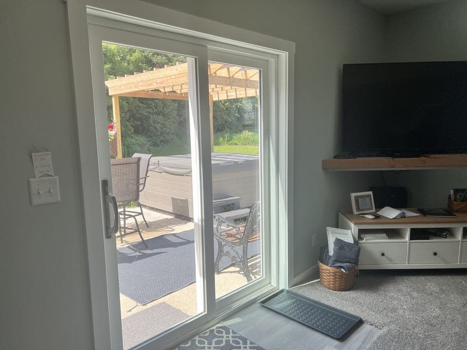 Sliding glass doors provide a private entrance to the lower level. 