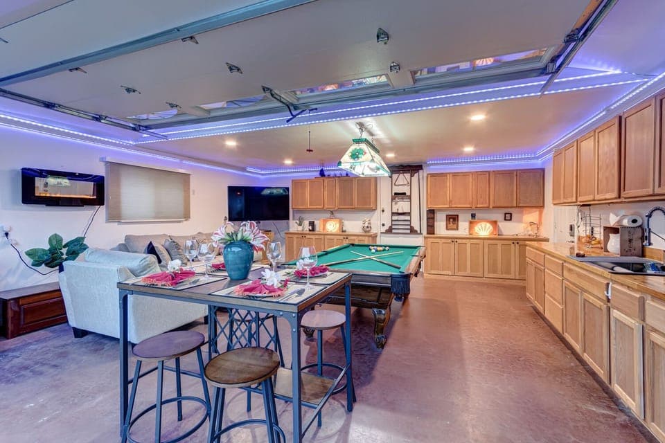 Great room with Billiard or Ping Pong, Quee Sofa Couch, 75" TV, dining table wit