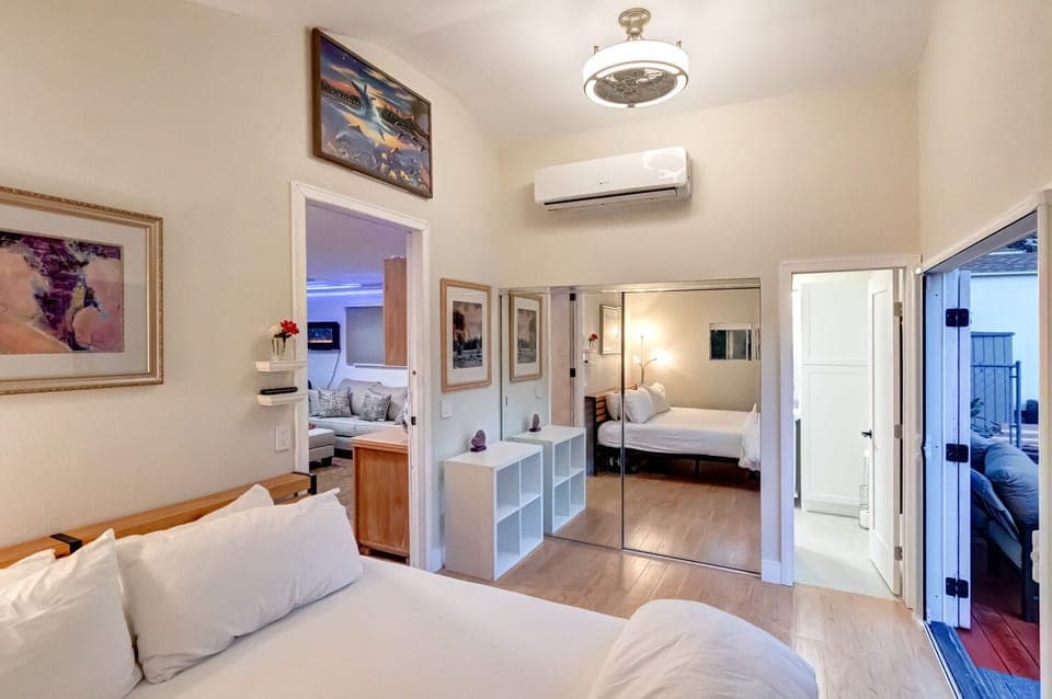 King bed with luxury linens, Large 75" TV, private bath, and private deck.