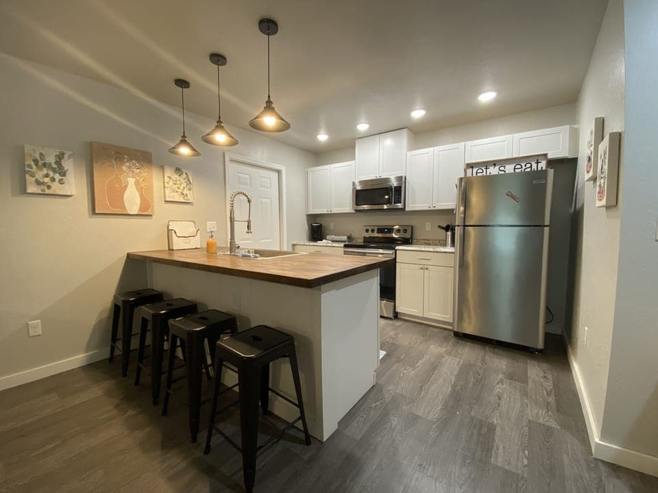 Modern kitchen fully equipped for your dine in needs. Keurig, crockpot, toaster.
