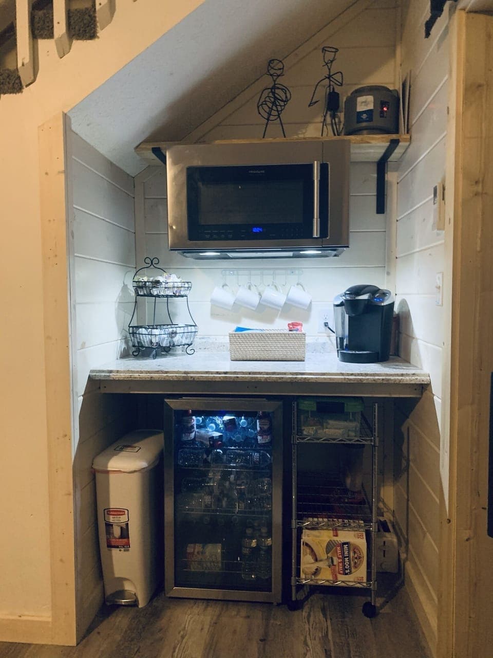 kitchenette area in lower level  with coffee maker , microwave and small fridge
