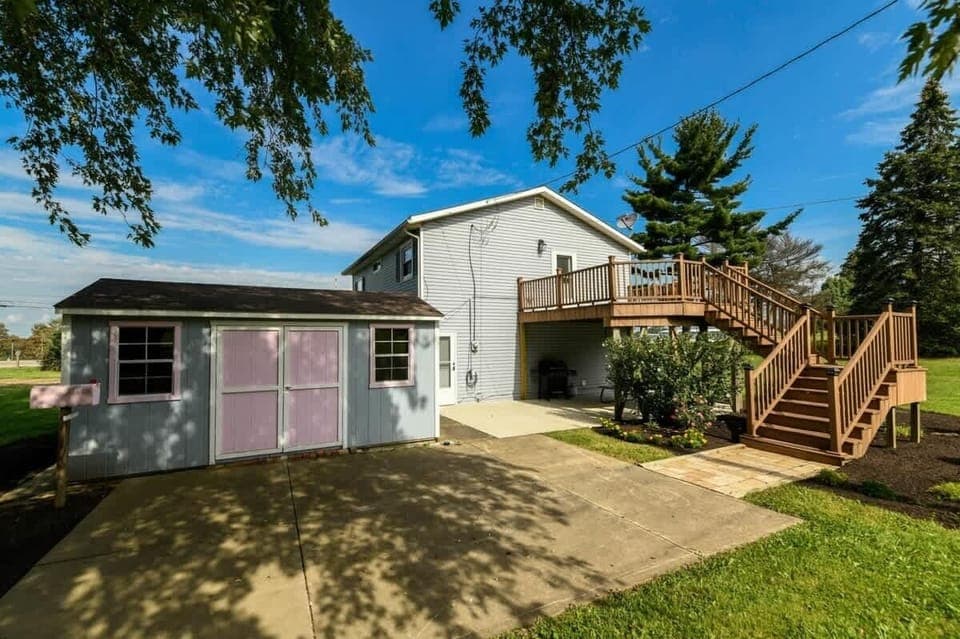 Rear of the house Admire the beauty of the home from the rearview, where the spacious backyard and thoughtfully designed exterior come together to create a tranquil and inviting setting. Perfect for outdoor relaxation and enjoying the view.