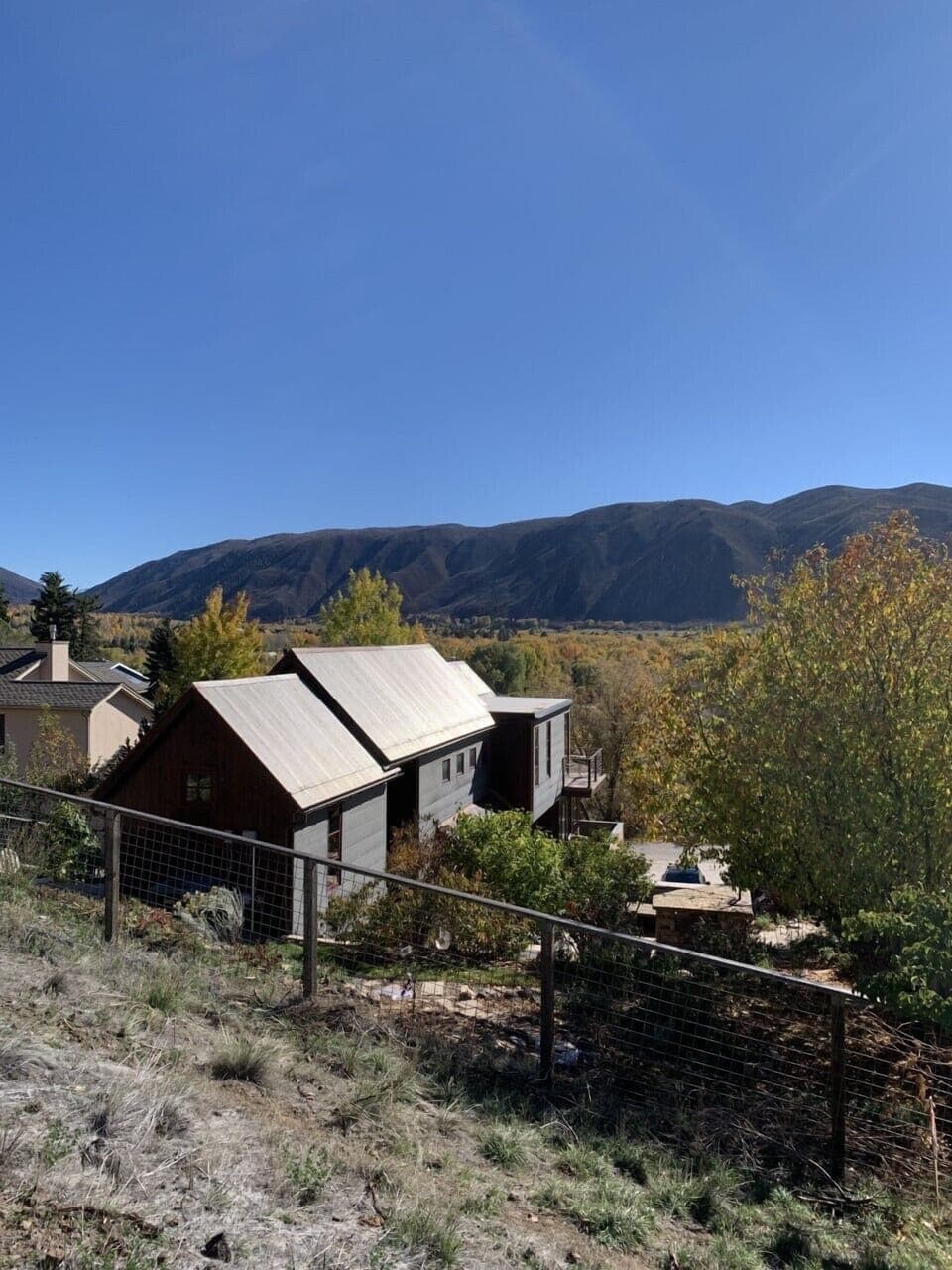 Back yard view towards Aspen Snowmass (fenced yard keeps dogs and kids safe) 