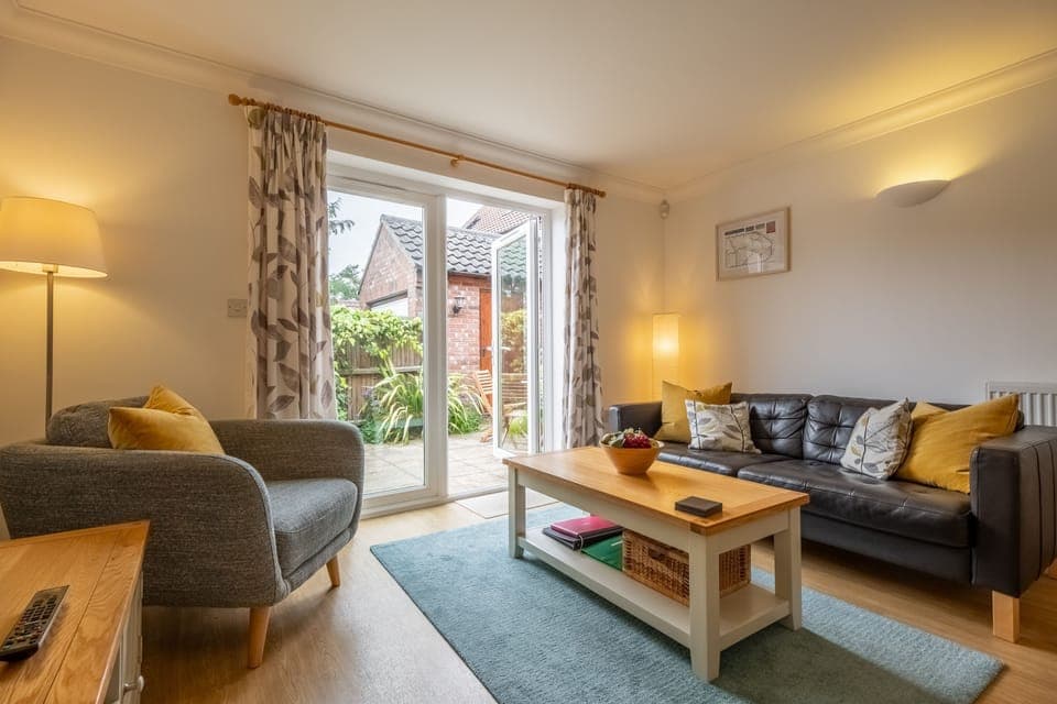 Rowan Cottage, Holt: French doors open out into the courtyard garden