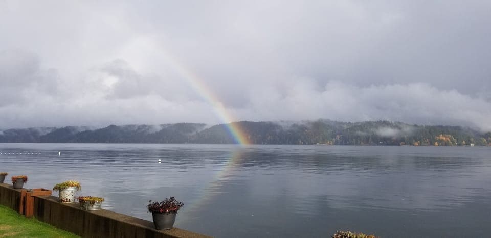 Amazing rainbows over hood canal right off the beach.