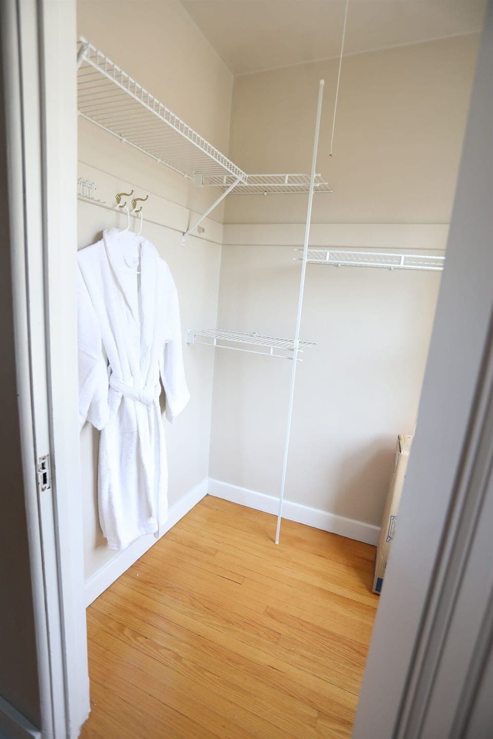 The E Bedroom features two walk-in closets.  This walk-in closet holds the robes as well as a Pack N Play..