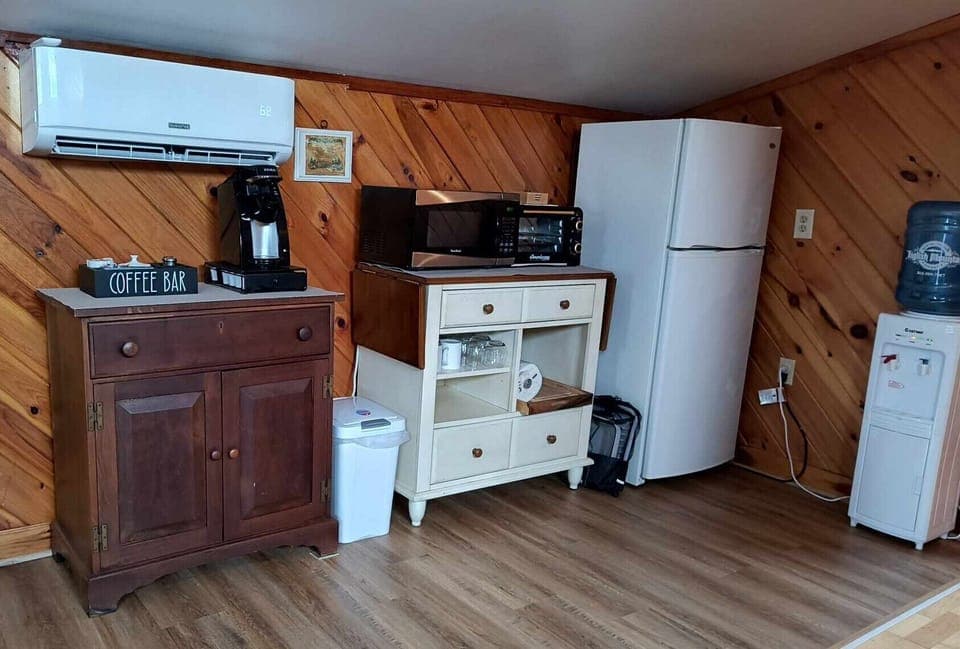 Kitchenette with coffee, microwave, toaster oven, fridge/freezer, water cooler