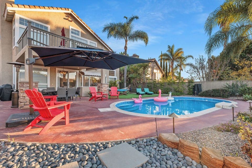 Backyard features a portofino hammock, 2 pool lounge chairs, 2 set table chairs