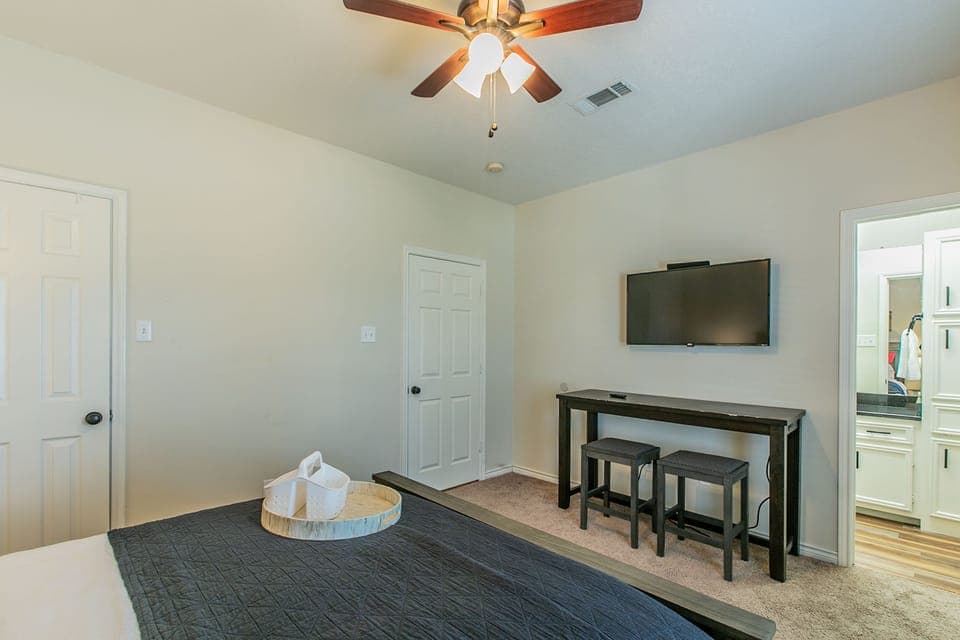 Queen Bed with TV and large closet and master bathroom