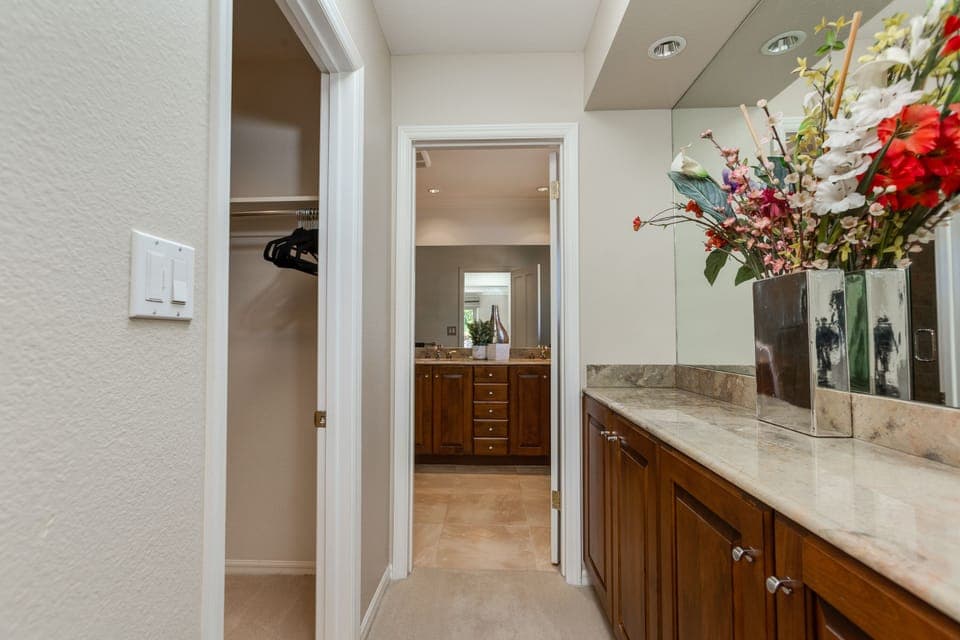 Master bedroom hallway to walk-in closet and bathroom.