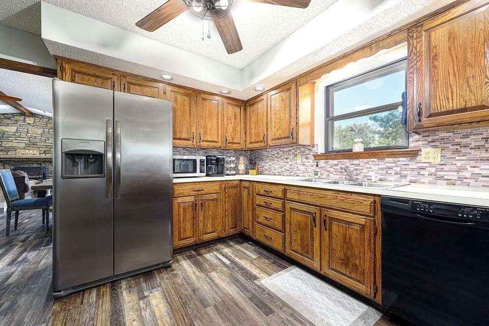 Both regular coffee and K cups provided, along with some creamers in the cabinet above. Our kitchen is fully stocked for your enjoyment with plenty of dishes, pots and pans, and platters to host!