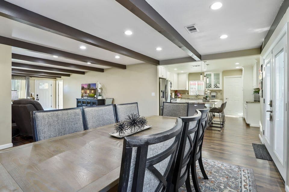 POV from the dining room towards the kitchen and laundry room. 