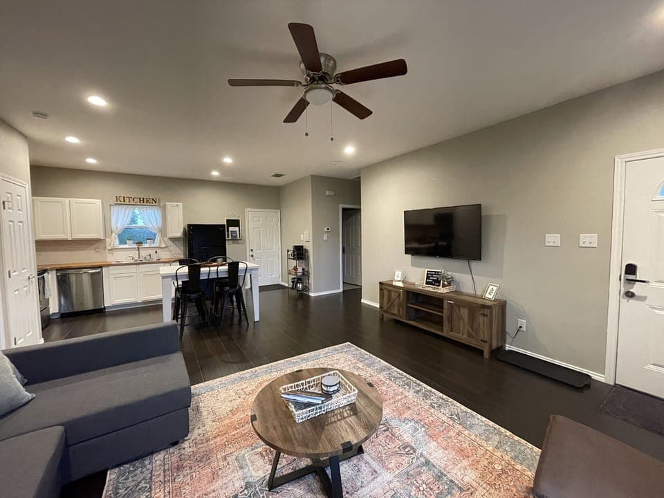 Living room is open to the kitchen so no one misses out!