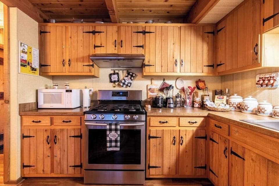 Beautiful wooden kitchen with full essentials to cook a meal! 