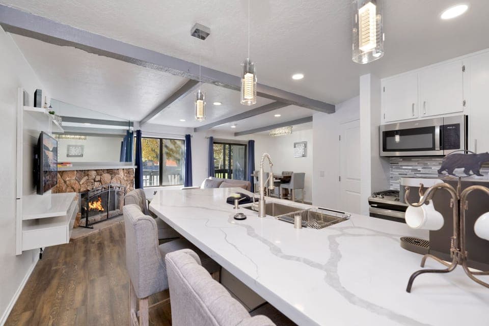 Fully equipped cabin kitchen with ample cabinetry, stove, fridge, microwave, and coffee maker—perfect for cooking meals, morning coffee, and feeling right at home on your stay.