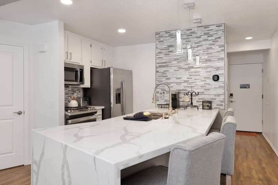 Fully equipped cabin kitchen with ample cabinetry, stove, fridge, microwave, and coffee maker—perfect for cooking meals, morning coffee, and feeling right at home on your stay.
