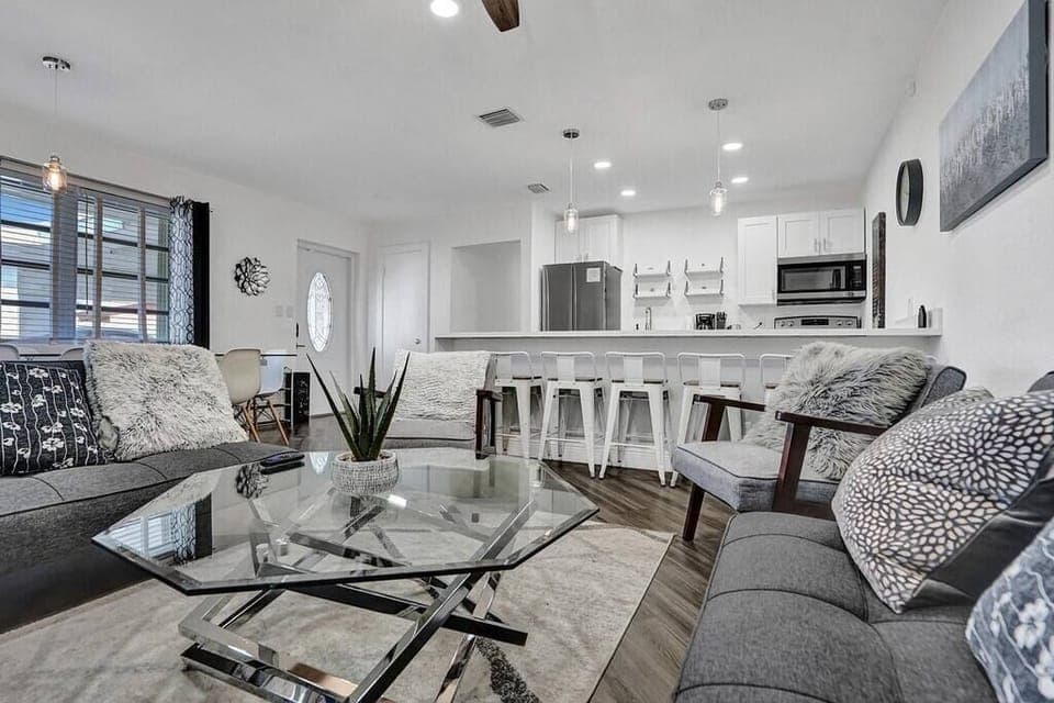 This is the living room. The space is cozy. It is also comfortable. 