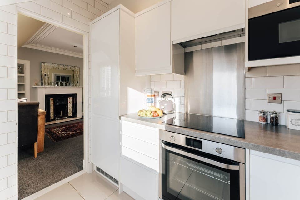 Bright open plan kitchen leading to living room