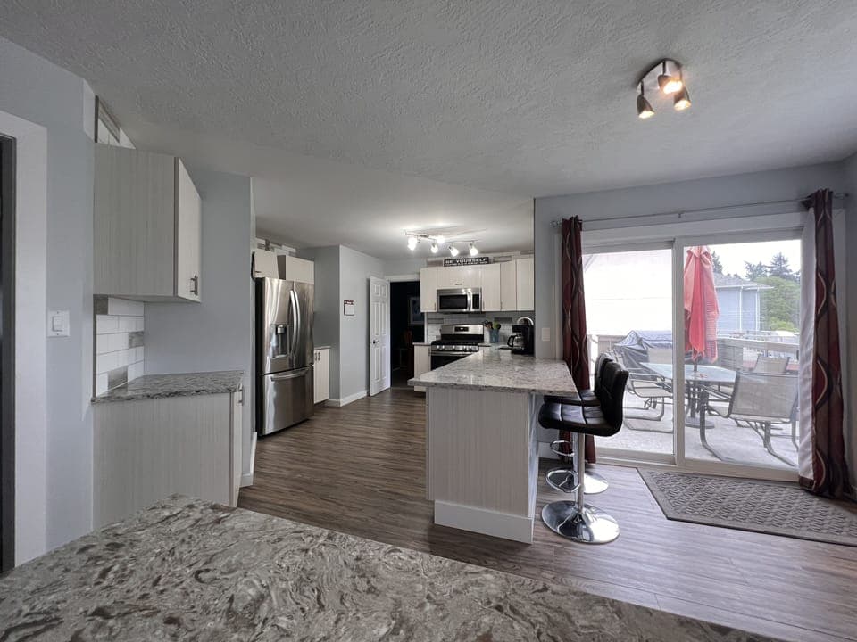 Kitchen from nook and family room