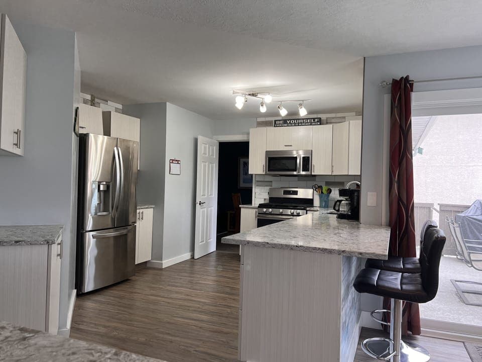 Kitchen from nook and family room