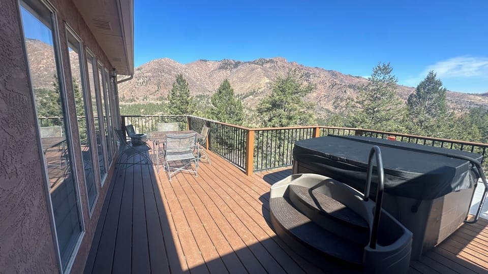 Main deck area with hottub and outdoor dining area.