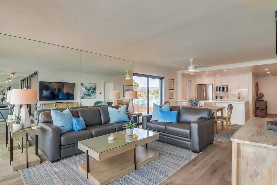 View of living room, dining space and kitchen