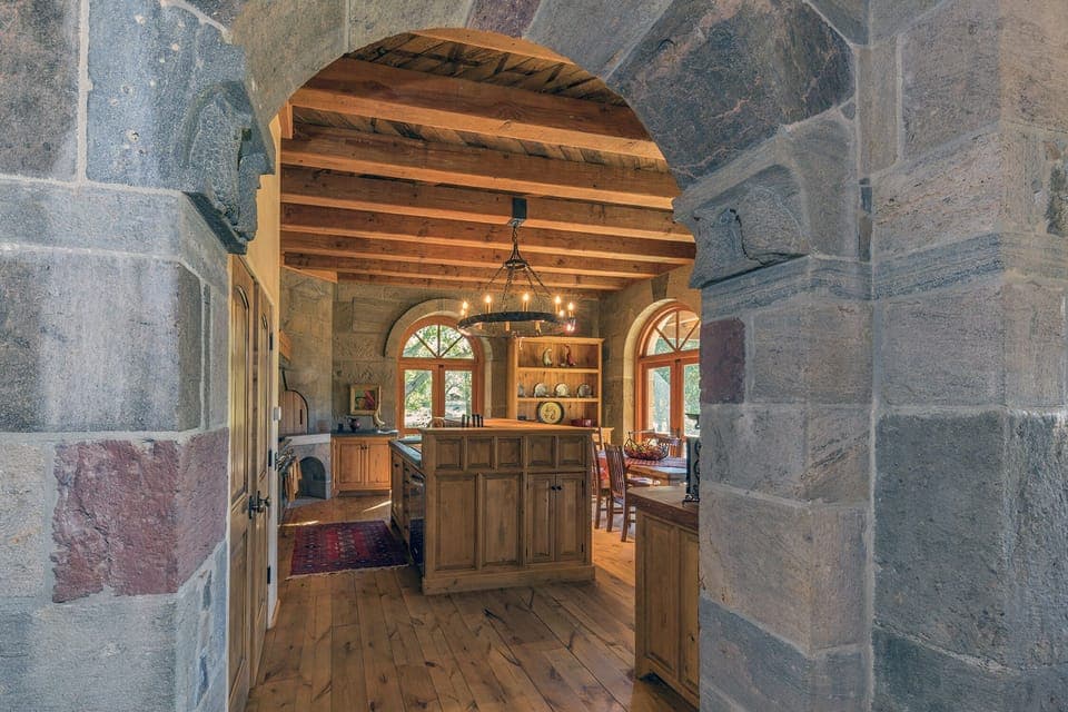 
Handcrafted Stone Archway from Living and Dining to Kitchen
