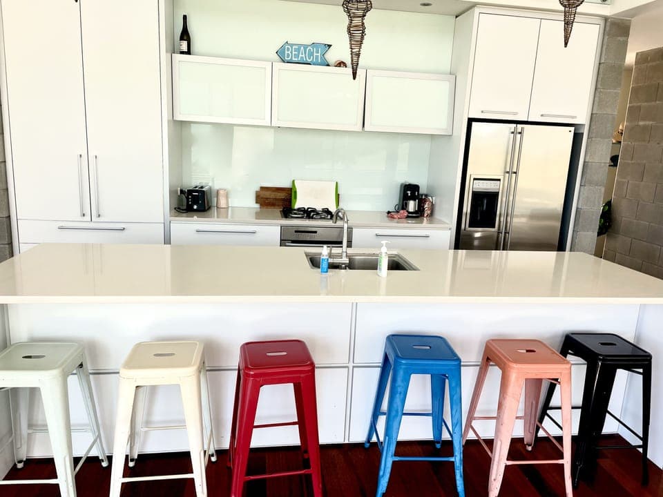 Large modern kitchen with island brunch bar.