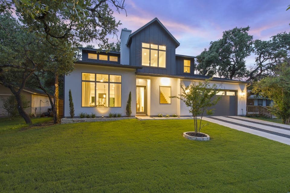Front of this beautiful two-story house at night