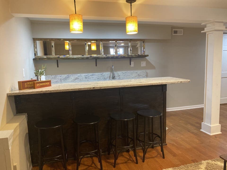 Wet bar with seating and undercounter refrigerator