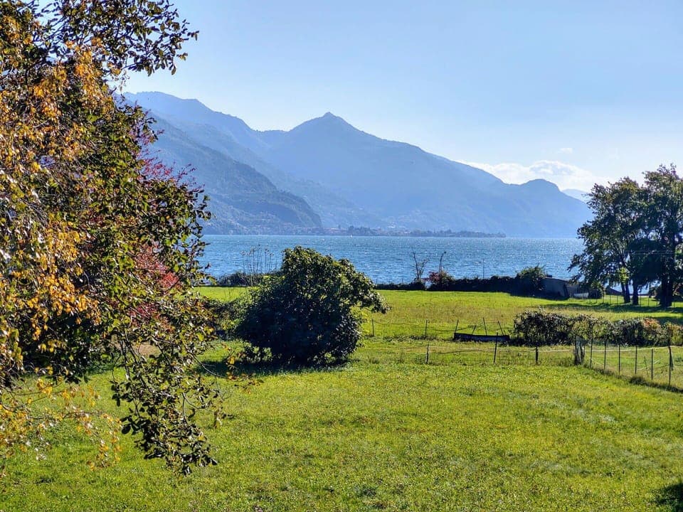 Sky, Mountain, Daytime, Building, Plant, Natural Landscape, House, Vegetation, Highland, Tree