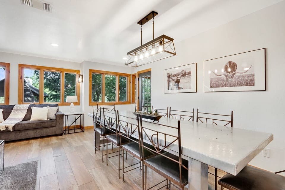 Right next to the kitchen is the dining room table.