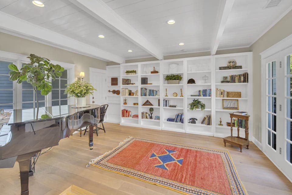 Quiet room with a piano and access to the back courtyard