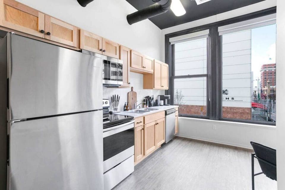 Sleek, fully stocked kitchen with high-end appliances—perfect for home-cooked meals or morning coffee.