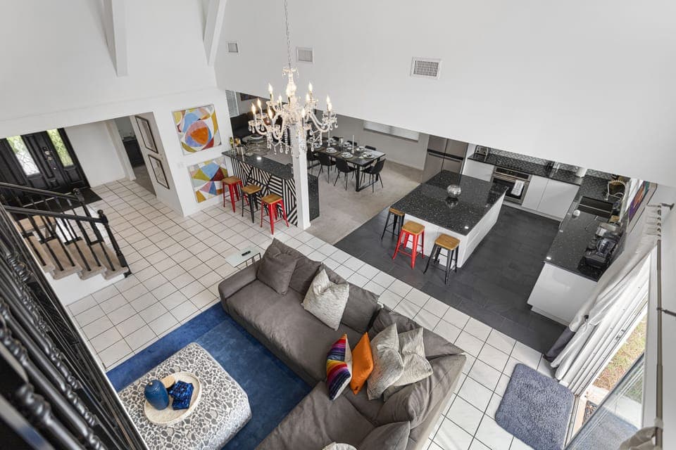 aerial view of living room, kitchen and dining room