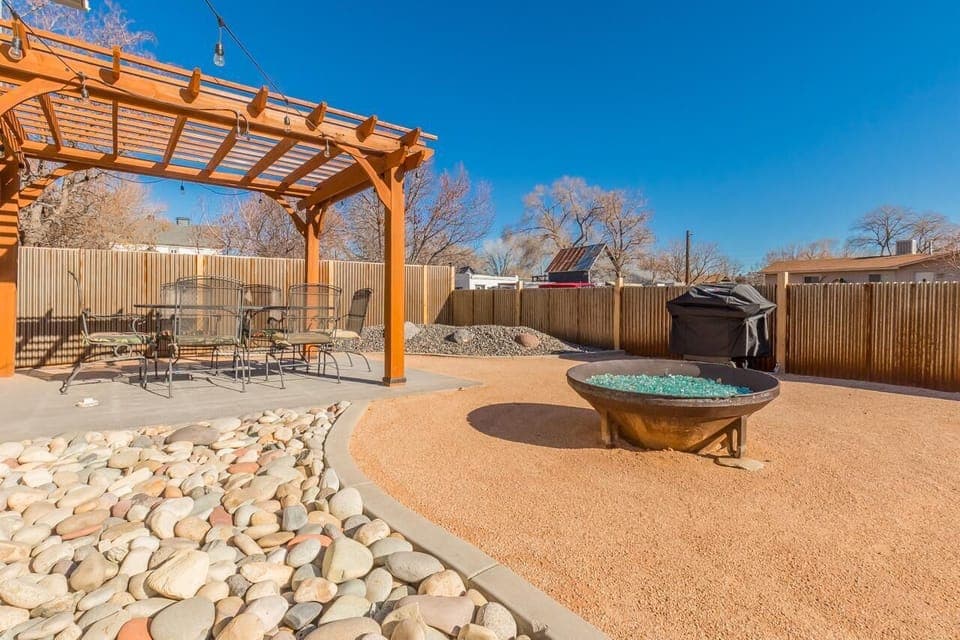 Relax under the pergola or unwind by the firepit.
