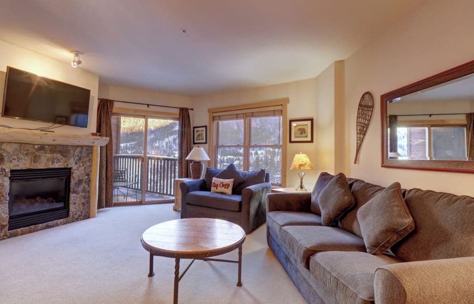 Cozy living room area featuring a private balcony.