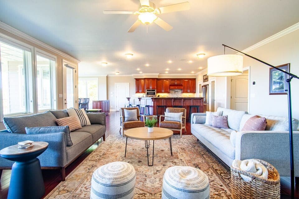 Bright and airy, this living room invites warmth and comfort with plenty of lighting.