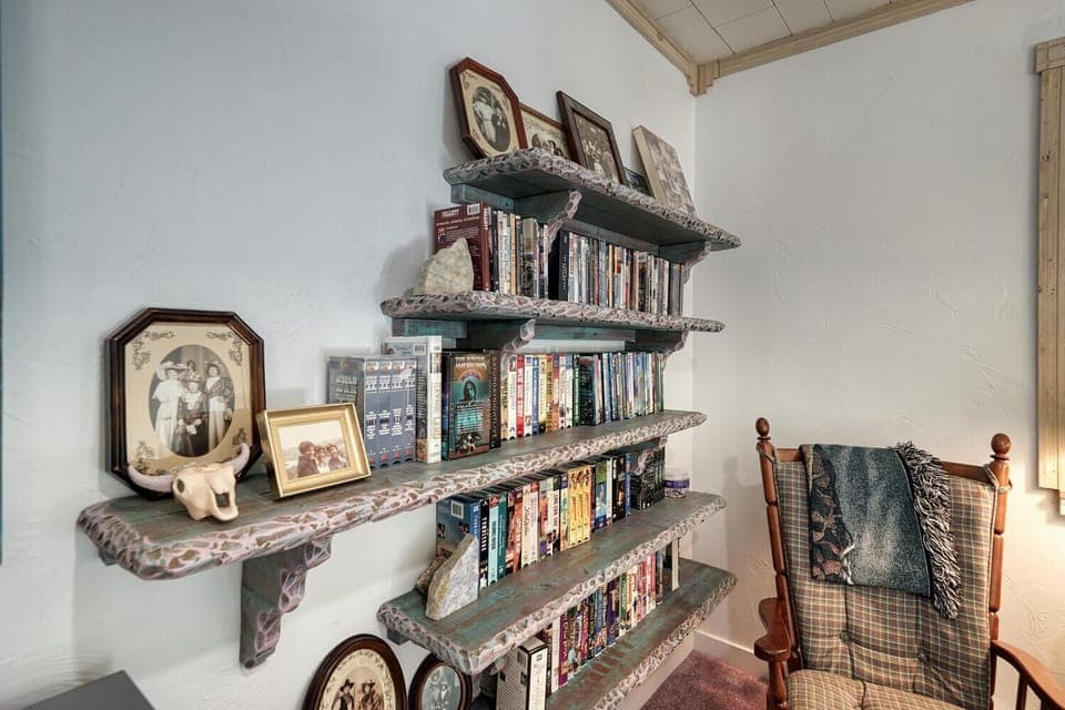 Lofted family area with movie collection.