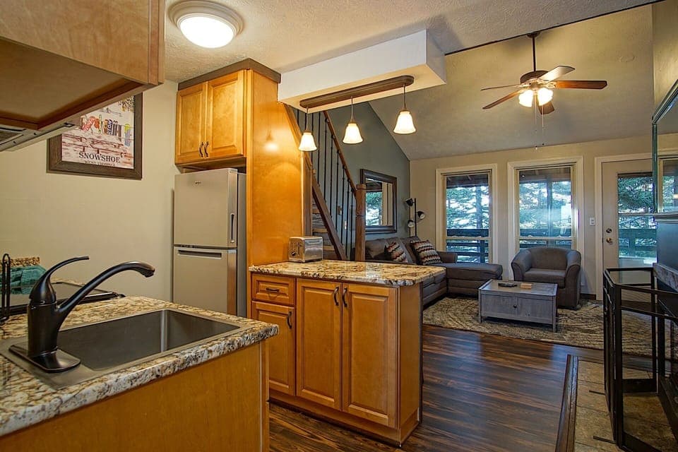 View of living room and balcony from the kitchen