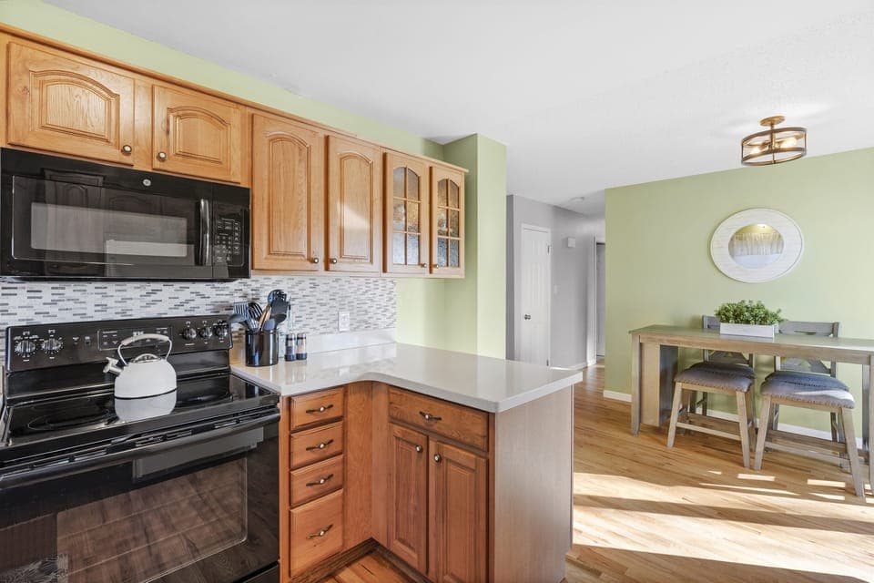Fully stocked kitchen for cooking meals.