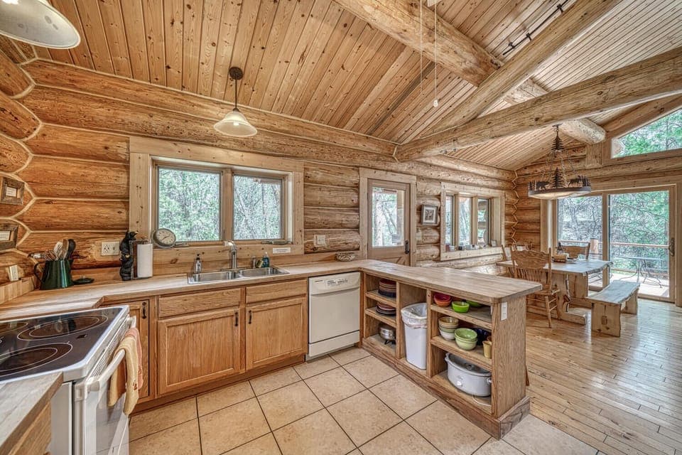 Fully-appointed kitchen with bar seating.