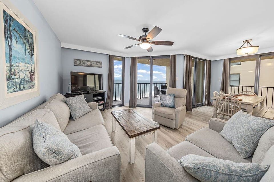 Living area has access to balcony overlooking the white sand beach!