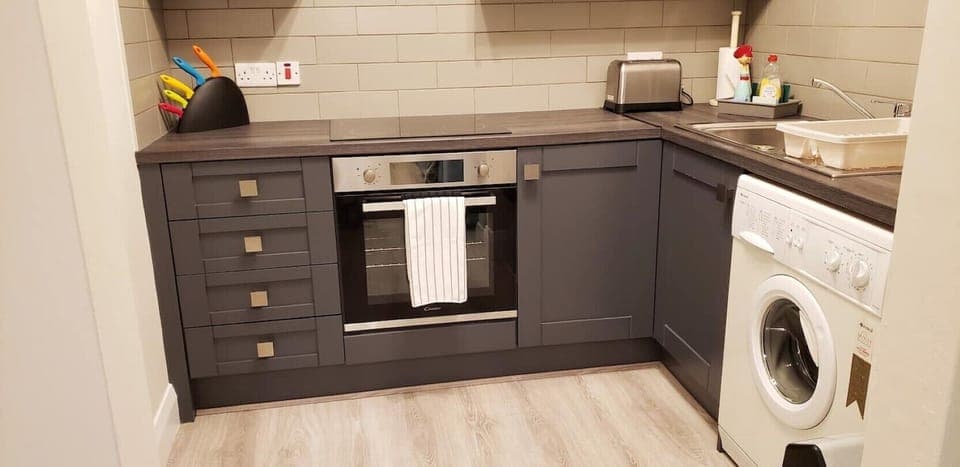 Kitchen showing stove and washer.