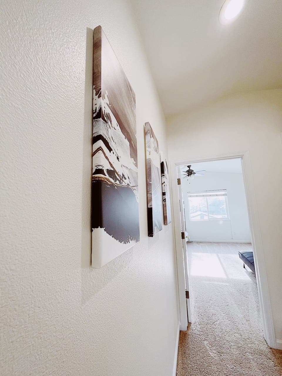 Modern neutral art brings a calm tone to the space. 