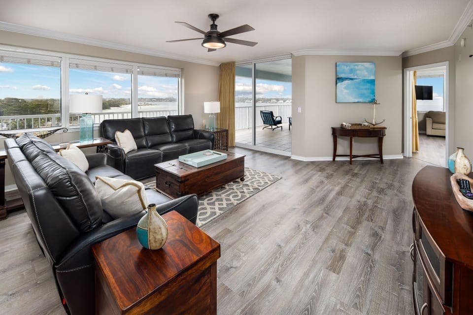 Living Room: Bright space with stunning views, sleek furniture, and inviting coastal decor awaits!