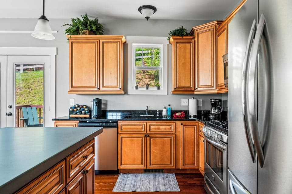 Well stocked kitchen with expanded concrete kitchen island.